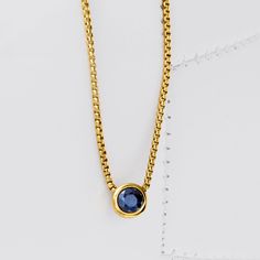 Ross-Simons - .60ct Bezel-Set Sapphire Adjustable Necklace in 18kt Yellow Gold Over Sterling. You'll love the versatility of this sweet solitaire necklace. A .60 carat bezel-set round sapphire takes center stage on an 18kt yellow gold over sterling silver box chain. Using a sliding mechanism at the clasp, the chain adjusts up to 18". The adjustable length makes it easy to wear with almost any neckline. Lobster clasp, blue sapphire solitaire necklace. Sapphire birthstones are the perfect gift for Anniversary Yellow Gold Necklaces With Tension Setting, Yellow Gold Solitaire Necklace With Tension Setting, Yellow Gold Round Birthstone Solitaire Necklace, Yellow Gold Solitaire Necklace With Birthstone, Classic Everyday Solitaire Necklace With Birthstone, Classic Everyday Birthstone Necklace With Bezel Setting, Everyday Solitaire Birthstone Necklace, Round Cut, Classic Yellow Gold Birthstone Necklace For Anniversary, Classic Yellow Gold Solitaire Necklace With Tension Setting