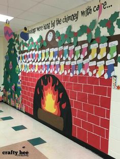 a classroom wall decorated with christmas decorations and paper cutouts on the brick fire place