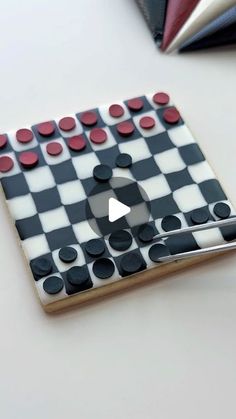 a piece of art that is made to look like a checkerboard board