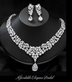 Stunning CZ Wedding Jewelry Set Complete your fabulous wedding day look with our glistening CZ necklace and drop earring set. This glamorous silver plated jewelry set is adorned with brilliant AAA quality CZ crystals that will add dazzling sparkle to any wedding or special occasion ensemble. Size: The necklace is about 15 3/4" long and the pierced earrings are about 2 1/3" long. Color: Silver. Style: ne10087. Please allow 3 weeks for delivery. Shipping Policy . Return Policy Winter Wedding Accessories, Gold Bridesmaid Jewelry, Rose Gold Wedding Jewelry, Formal Jewelry, Wedding Jewelry Set, Bridesmaid Pearls, Pearl Jewelry Wedding, Fabulous Wedding, Gold Headband