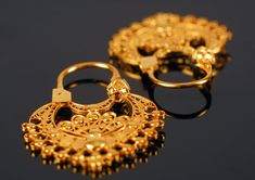 "The design of these beautiful Horseshoe earrings is inspired by models of \"fan\" or \"half moon\" earrings used by women in the 18th and 19th centuries, in the Salamanca region. The earrings are handmade with 18K gold and filigree technique. They're a light and delicate jewel and an ideal complement for any occasion. Features of this piece: Name: Horseshoe Earrings* Size: 32 X 24 mm Thickness: 4 mm Materials: 18K yellow gold Weight: 4.00 g Techniques: Filigree, handcrafted jewelry Finish: 24K Elegant Pierced Hoop Earrings For Ceremonial Occasions, Elegant Ceremonial Hoop Earrings, Gold Earrings With Artistic Design, Traditional Pierced Hoop Earrings For Wedding, Traditional Wedding Hoop Earrings, Elegant Hoop Earrings For Ceremonial Occasions, Ornate Hoop Earrings For Wedding, Festive Filigree Hoop Earrings Gift, Festival Hoop Filigree Earrings