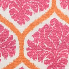 an orange and pink pattern on fabric