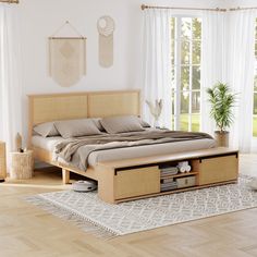 a large bed sitting on top of a hard wood floor next to a window filled with white curtains