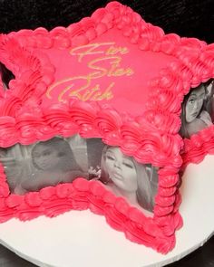 the cake is decorated with pink frosting and photos