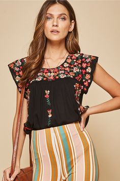 We love the vibe of this gorgeous embroidered top. It features a round neckline, colorful embroidery, flutter sleeves and a relaxed a-line fit. Pair this up with skinny jeans and booties for a chic look! Small Bust 38" L 24" : Medium Bust 40" L 24" : Large Bust 42" L 24" 1X Bust 48" L 27" : 2X Bust 50" L 27" : 3X Bust 52" L 27" 100% Rayon - no stretch Hand wash cold Striped Bell Bottoms, The Obsession, Colorful Embroidery, Woven Top, The Vibe, Kimono Jacket, Knit Pants, Large Bust, Flutter Sleeves