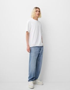 Straight fit ’90s jeans - Jeans - Men | Bershka 90s Style Relaxed Fit Wide Leg Jeans, 90s Relaxed Fit Wide Leg Jeans, 90s Wide Leg Relaxed Fit Jeans, Streetwear Flare Jeans With Straight Hem, Casual Jeans Five Pockets For Elevated Casual Look, Casual Jeans With Five Pockets, Relaxed Fit Tapered Leg Flare Jeans For Streetwear, Spring Streetwear Cropped Rigid Denim Jeans, Streetwear Tapered Leg Flare Jeans With Five Pockets