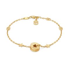 This precious bracelet is presented in 18k yellow gold with a delicate chain featuring the GG motif.The piece's focal point is a circular charm featuring a cut-out star, that recalls the Gucci Cosmogonie fashion show.Style ‎729370 J8500 800018k yellow goldCharm with cut-out starGG motifClasp closureAdjustable length: 6.3" or 7"Made in Italy Gucci Cosmogonie, Fall Rings, Star Constellations, Diamond Supply, Star Bracelet, Delicate Chain, Yellow Gold Bracelet, Yellow Gold Earring, Metal Bracelets