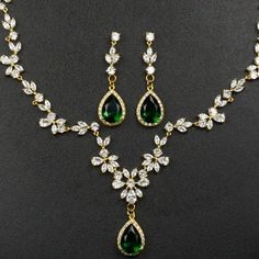 Green Crystal Jewelry Sets With Jewels, Elegant Green Crystal Jewelry Sets, Cubic Zirconia Emerald Necklace For Wedding, Elegant Green Bridal Sets For Parties, Green Hand Set Cubic Zirconia Bridal Earrings, Hand Set Green Cubic Zirconia Bridal Earrings, Elegant Green Bridal Set For Wedding, Elegant Green Cubic Zirconia Bridal Necklace, Green Crystal Necklace For Wedding