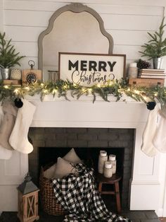 a fireplace decorated for christmas with stockings and stocking