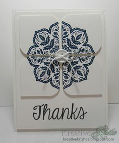 a thank card with a blue and white flower design on the front, saying thanks