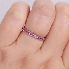 Featuring a series of beautiful pink tourmaline stones, this 10k white gold eternity ring offers a fun and gorgeous touch to any outfit. Featuring a series of beautiful pink tourmaline stones, this 10k white gold eternity ring offers a fun and gorgeous touch to any outfit.Click on this JEWELRY & WATCHES GUIDE to learn about fit, styles, materials and more! Width: 2.5 mm Metal: 10k white gold Plating: rhodium Finish: polished Packaging: boxedSTONE DETAILS Stone type: pink tourmaline Total weight: Elegant Pink Jewelry With Channel Set, Elegant Pink Channel Set Jewelry, Pink Round Cut Ruby Ring In Fine Jewelry Style, Fine Jewelry Pink Ruby Ring With Round Cut, Fine Jewelry Pink Round Cut Ruby Ring, Pink Sapphire Stackable Ring Gift, Pink Ruby Stackable Jewelry, Pink Ruby Ring With Prong Setting, Pink Stackable Sapphire Ring Gift