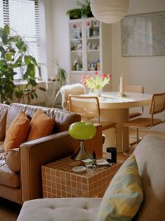 a living room filled with furniture and a table