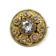 Detailed and beautiful, this brooch was created in the early to mid 1800s. Condition Report: Excellent   The Details... This brooch is constructed from Pinchbeck and features Pinchbeck flowers and leaves and is detailed with Pinchbeck frogging and chain. It is set with large and small, round, claw set Rock Crystals. The brooch fastens with a 'C' catch and the fastening pin is attached to the brooch with a tube hinge. The brooch measures 3.5cm in diameter.  Wear it With... Brooches are an excepti Vintage Drop Earrings, Black Stickers, Jewelry Manufacturers, Rock Crystal, Flowers And Leaves, Flower Brooch, Vintage Brooches, Christmas Shopping, Cross Pendant