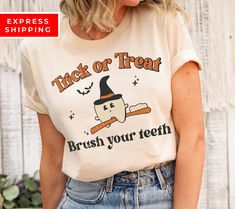 A cute Halloween dentist tooth shirt, the perfect gift for any RDH, RDA, or CDA who loves funny spooky tees! Our t-shirts are 100% made in the USA, hand printed with a professional garment printer and using only the best water-based inks, for a high-quality unisex t-shirt that is insanely soft.  ⭐ PREMIUM QUALITY ⭐ Made in the USA! 📏 SIZING: This shirt is unisex fit. We always recommend our customers to size up for a stylish oversized look. You can see our Size Chart in the listing photos :) ⚡📦  EXTRA FAST SHIPPING ⚡📦   Items are dispatched within 1-2 days.  With Standard Shipping you will receive the item in: ◼️ US: 2-5 business days ◼️ Rest of the world: 10-30 business days ⚡ IF YOU CHOOSE EXPRESS SHIPPING YOU WILL RECEIVE THE ITEM WITHIN 72 HRS MAX ⚡ ✨ CARE INSTRUCTIONS Machine wash: Dental Hygiene Gifts, Oversized Look, Dental Assistant, Dental Hygiene, Cute Halloween, Cute Shirts, Trick Or Treat, Halloween Shopping, Sweat Shirt