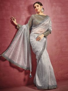 Adorable grey fancy fabric designer saree online for women which is crafted from fancy fabric fabric and comes with art silk blouse. Silver Pre-draped Saree For Eid, Silver Semi-stitched Pre-draped Saree For Designer Wear, Designer Silver Saree With Zari Work, Silver Blouse Piece With Traditional Drape For Designer Wear, Designer Silver Blouse Piece With Traditional Drape, Silver Blouse With Sheer Dupatta And Traditional Drape, Traditional Silver Blouse Piece With Sheer Dupatta, Silver Chanderi Blouse Piece With Traditional Drape, Silver Blouse Piece With Traditional Drape For Eid