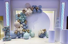 balloons are arranged in the shape of a letter on display at a wedding or baby shower