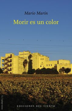 a yellow building with palm trees in the background