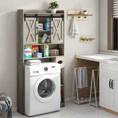 a white washer sitting next to a dryer in a bathroom under a window