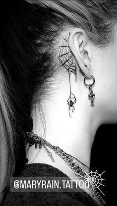 a woman with spider web tattoo on her neck