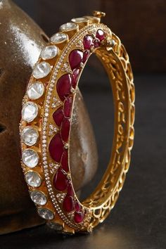 18kt gold plated kada with red utrai on both sides and polki embellishment. - Aza Fashions Jewellery Bangles, Both Sides, Aza Fashion, Embellishments, Gold Plate, Bangles, Plating, Sparkle, Silver