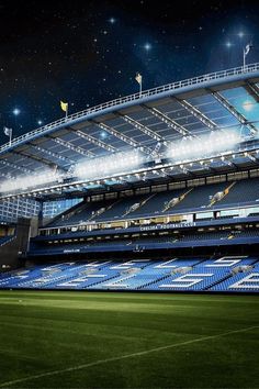 an empty soccer stadium at night with bright lights