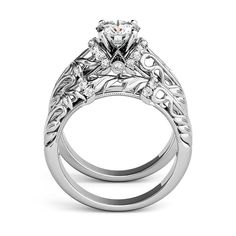 a white gold engagement ring set with an intricate design