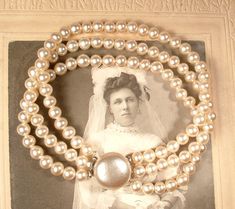 "Offering a beyond gorgeous high-end, very well made vintage 1930s to 1940s era glass champagne ivory pearl Art Deco bracelet perfect for the Bride! This bracelet is exquisite! Photos do not begin to do it justice. The bracelet features three strands of lustrous glass pearls in a warm champagne/eixh ivory tone. The bracelet has an elegant glass pearl cabochon claps just like the kind used by the legendary jewelry designer \"Miriam Haskell\". I just adore the simple yet striking design! The pinch Vintage White Pearl Bracelet For Anniversary, Vintage Pearl Bracelet For Formal Occasions, Vintage Pearl Bracelet For Wedding, Vintage Pearl White Wedding Jewelry, Vintage Pearl Bracelet For Anniversary, Cream Pearl Bracelet With Round Beads For Wedding, Vintage Pearl Bracelet With Round Beads For Formal Occasions, Vintage Pearl Bracelet With Round Beads For Wedding, Elegant Cream Pearl Bracelet For Wedding