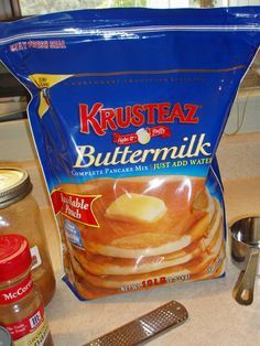 a bag of buttermilk sitting on top of a counter next to a measuring spoon