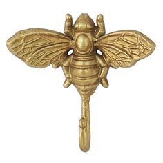 a gold colored bee hook on a white background