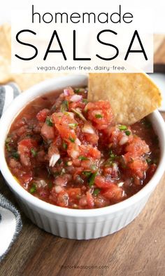 homemade salsa in a white bowl with tortilla chips