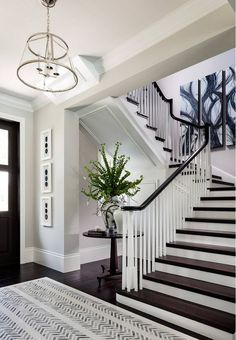 a white staircase with black and white decor