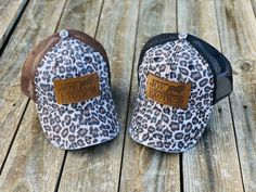 "Jump on the \"Tiger King\" wagon! This hat is so stinking cute ...who doesn't love the cheetah print?? You will love wearing this comfortable hat while looking AWESOME. HAT INFORMATION: real leather patch snap adjustable tab with mesh back 60% cotton 40% polyester one size fits most distressed to give worn look All orders within US will ship via USPS first class with tracking to arrive within 5-8 business days depending on your location." Leopard Hat, Camping Hair, Joe Exotic, Leather Engraving, The Cheetah, Tiger King, Ball Caps, The Tiger, Custom Leather