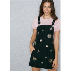 We're Loving This Black Denim Pinafore Dress, It's Been Prettified With Gorgeous Floral Embroidery. Featuring Semi-Detachable Straps And Two Large Front Pockets, We're Teaming It With Our Favourite Tees And Sandals. 100% Cotton. Machine Wash. Black Pinafore, Yellow Bodycon Dress, Embroidered Denim Dress, Barbie Pink Dress, Denim Pinafore Dress, Denim Pinafore, Mini Gold Dress, Strappy Mini Dress, Slinky Dress