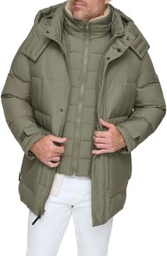 Stay cozy all winter in this parka that features a drawcord hood and a removable bib made with lustrous, lightweight down & feather fill. 33 1/2" length Stand collar; removable drawcord hood Adjustable hook-and-loop cuffs Water-resistant Lined, with down and feather fill 100% polyester Dry clean Imported Cold Weather Down Parka With Drawstring Hood, Casual Down Parka With Detachable Hood, Down Parka With Double-lined Hood, Weatherproof Down Parka For Fall, Weatherproof Down Parka, Down Parka With Detachable Hood, Outdoor Down Parka With Drawstring Hood, Green Parka Jacket, Green Parka