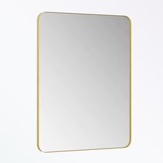 a square mirror with a gold frame