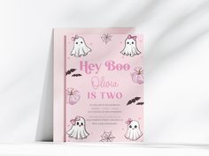 a pink birthday card with ghostes and bats on it, says hey boo ghoo is two