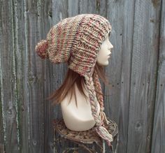 "Style: Charlotte - a slouchy beanie pom pom hat. Color: This sample hat is shown in Jam Cookie, tan mixed with cherry red, eggplant and slate grey. Sizes: One size fits average teen or adult head size of 20\" to 23\" (50.5 cm to 58 cm). Fiber Content: 80% acrylic, 20% Wool Characteristics: Chunky, very soft, warm and cozy. Care Instructions: Hand wash, dry flat. Every item from Pixiebell is handmade and knit or crocheted to order, unless otherwise stated in title of the item as \"ready to ship\ Bohemian Style Hats For Cold Weather, Bohemian Knitted Hats For Cold Weather, Beanie Pom Pom, Hat Pom Pom, Fall Fashion Accessories, Girlfriends Day, Chunky Knit Hat, Pixie Hat, Handmade Knitwear