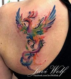 a woman with a colorful tattoo on her back