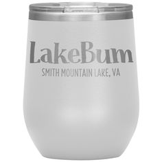 the lake bumm stemless wine tumbler is shown in white and has grey lettering