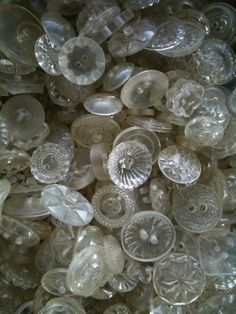 a pile of glass buttons sitting next to each other