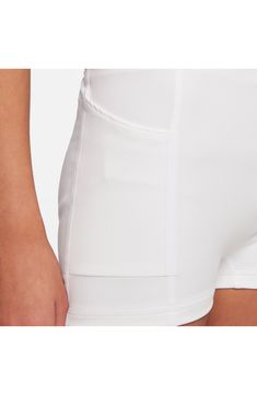 This breathable, kid-sized golf skirt will keep them comfortable on the green with a pleat-flared silhouette, stretchy inner shorts and helpful hidden pockets. 86% polyester, 14% spandex Machine wash, line dry Imported Nordstrom x Nike: A curated lifestyle destination where fashion is the ultimate sport White Stretch Skort With Pockets, White High Waist Skort With Elastic Waistband, White Fitted Tennis Skirt With Pockets, White Tennis Dress With Built-in Shorts, White Shorts With Waistband, White High Waist Tennis Skirt With Built-in Shorts, White Fitted Skort With Built-in Shorts, White Tennis Skirt With Built-in Shorts, White Tennis Skirt With Elastic Waistband