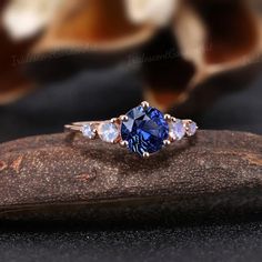 Art Deco Round Sapphire Engagement Ring Vintage Blue Gemstone | Etsy Blue Rose Promise Ring, Blue Sapphire Three-stone Promise Ring, Blue Three Stone Sapphire Promise Ring, Lab-created Sapphire Birthstone Wedding Ring, Tanzanite Three Stone Wedding Jewelry, Elegant Sapphire Moonstone Ring In Oval Shape, Elegant Sapphire Color Moonstone Ring, Lab-created Sapphire Three Stone Wedding Rings, Rose Gold Sapphire Ring With Gemstone