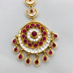 Sabyasachi Kundan Mang Tika/Ruby Mang Tikka/Pearl Maang Tika/Ruby Pearl Maang Tika/Kundan Maang Tikka/Kundan Big Mang Tikka/Bridal Jewelry Features: Length: 5 Inches 22 Carat Gold polish Jadau Ruby Crystals, Kundan and Pearl work Suitable for any Indian Traditional Attire FREE SHIPPING All our jewelry pictures are taken in natural light with no filters and enhancements. To stay updated on latest designs Follow Us on: Website: www.aryafashions.com Facebook: www.facebook.com/shoparyafashions Pinte Red Tikka For Festivals, Festival Tikka With Motifs For Puja, Red Kundan Necklace For Rituals And Festivals, White Bollywood Dupatta For Rituals, Bollywood Style White Dupatta For Rituals, Festive Dupatta With Latkans, Ceremonial Kundan Chandbali Necklace With Motifs, Red Kundan Necklace For Diwali Rituals, White Kundan Necklace With Motifs For Festivals