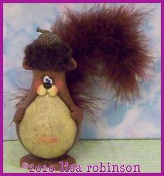 a stuffed animal with a hat on top of it's head and fur tail