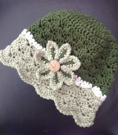 a crocheted hat with a flower on it