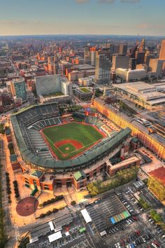 an aerial view of a baseball stadium in the city