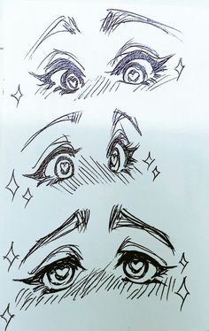 a drawing of eyes and stars on a sheet of paper