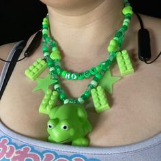 Feeling Hoppy? Or Maybe You Just Love Frogs? This Necklace Is For You! Features Squishy Frog Toy, Legos, And Glow In The Dark Stars. Length Is 19.5 Inches, But Can Be Made Longer. Green Fun Plastic Jewelry, Fun Green Plastic Jewelry, Playful Green Plastic Jewelry, Fun Green Necklaces For Gifts, Fun Green Necklaces For Gift, Fun Green Necklace For Gift, Handmade Green Novelty Necklace, Clowncore Jewelry, Decora Clothes