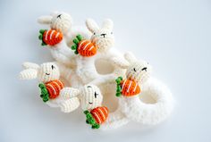 small knitted animals with carrots in their mouths