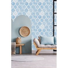 a blue and white wallpaper with an arch in the middle is next to a chair